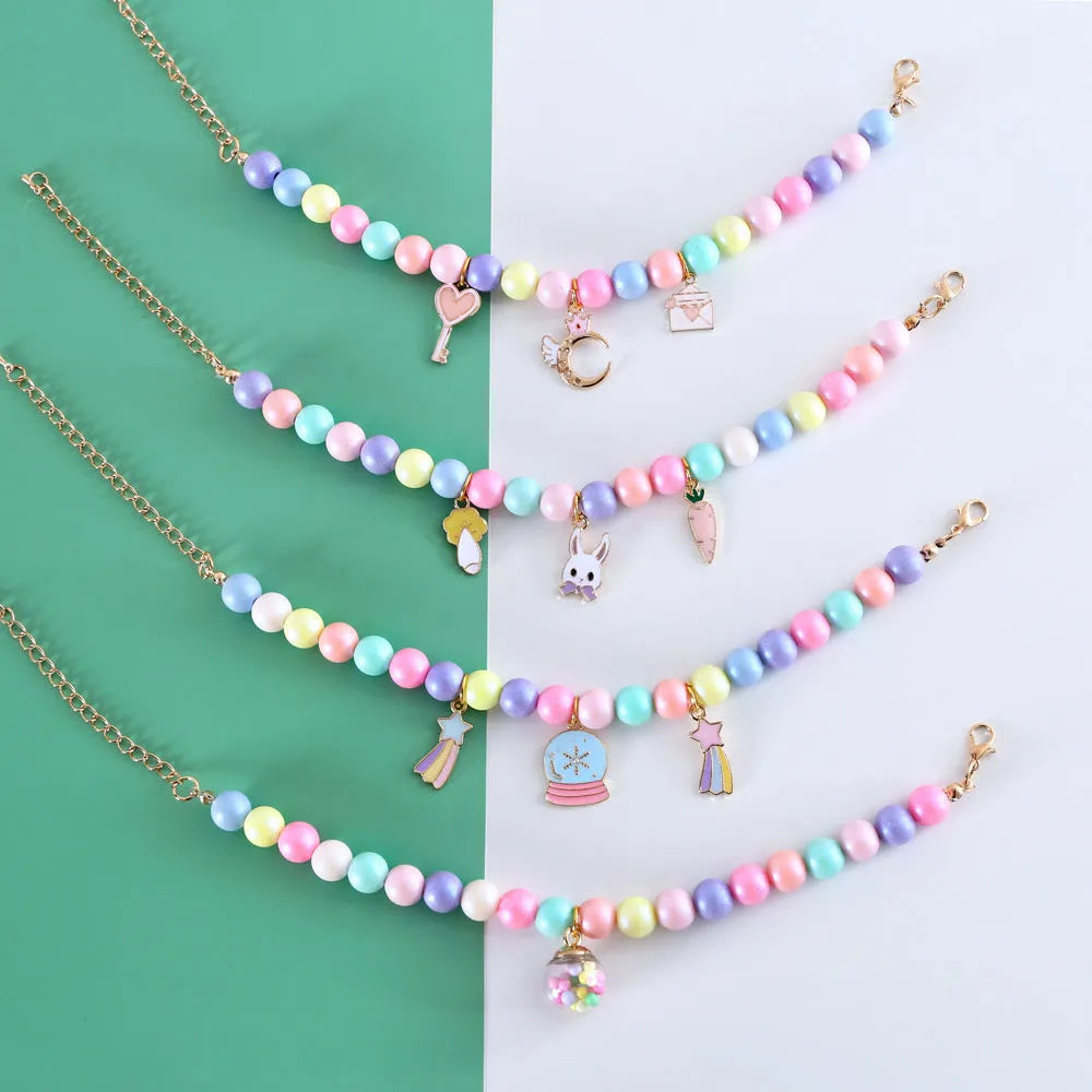 Macaron-coloured resin pet collar with moon charm and matching adjustable bracelet for cats or small dogs.