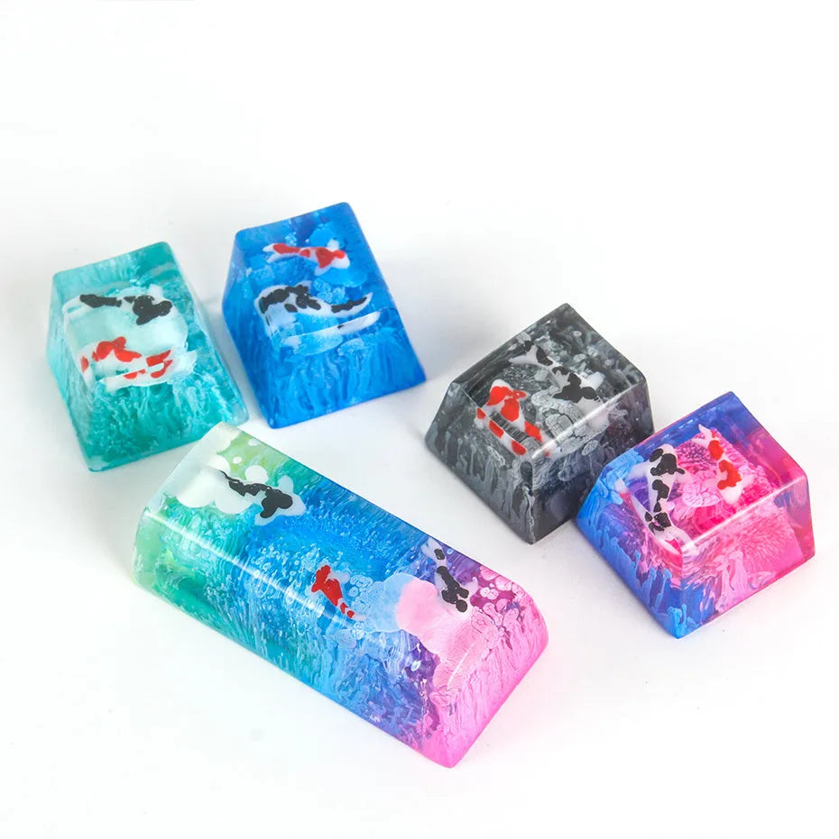 Resin keycap with koi fish swimming through scenery design for Cherry MX mechanical keyboards