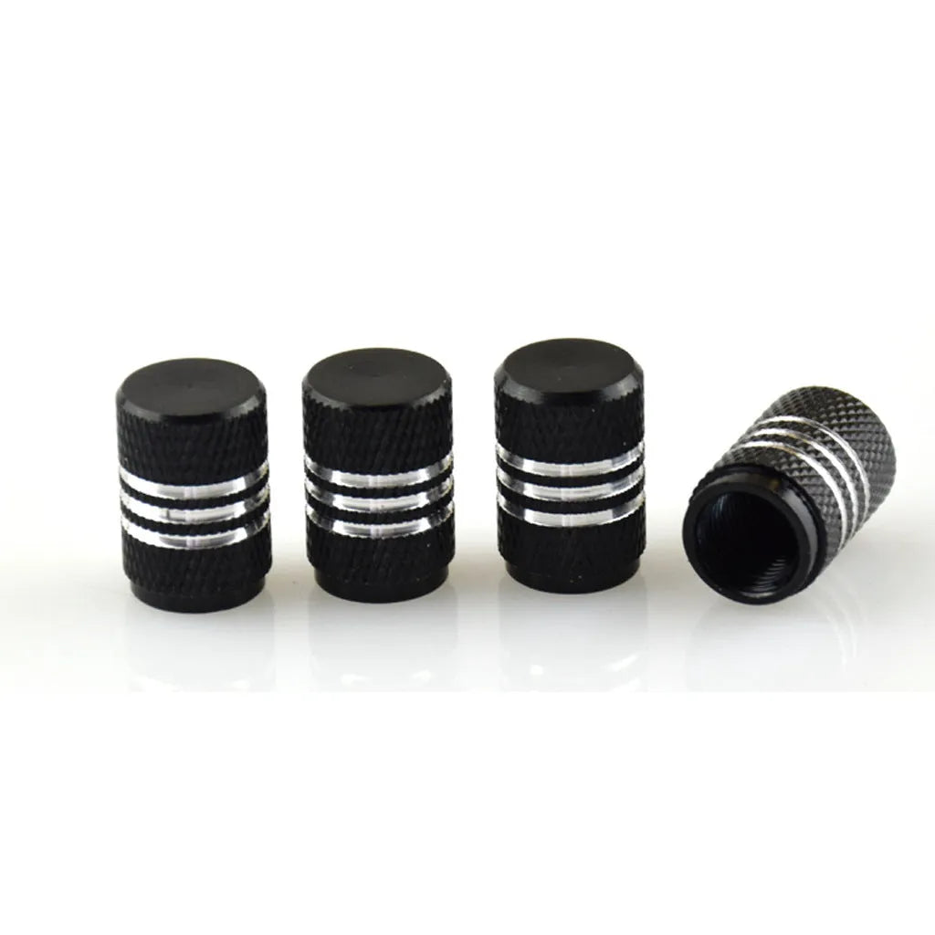 Set of stainless steel car tyre valve caps in multiple colours including red, blue, black, and silver.