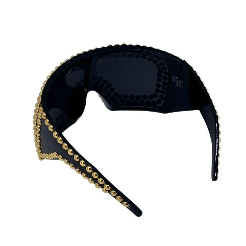 Men's punk-style sunglasses with a large square frame, rivet details, in silver or gold colour.