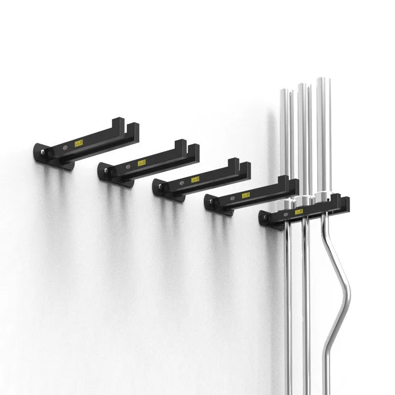 Wall-mounted black steel barbell rack holding multiple Olympic bars against a wall