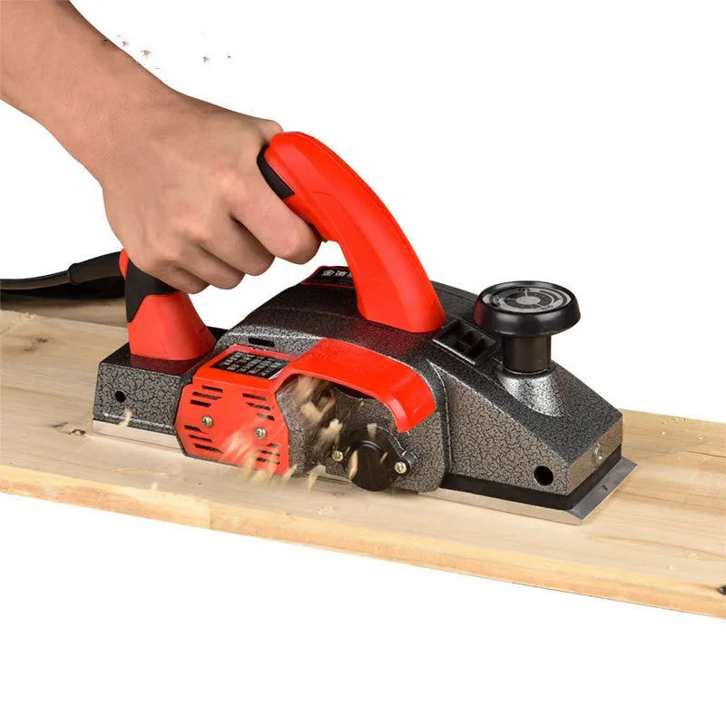 Red aluminium shell electric wood planer tool with 82mm planing width for carpentry work