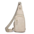 Soft brown PU leather women's crossbody chest bag with open front pocket.