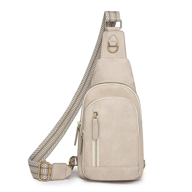 Soft brown PU leather women's crossbody chest bag with open front pocket.