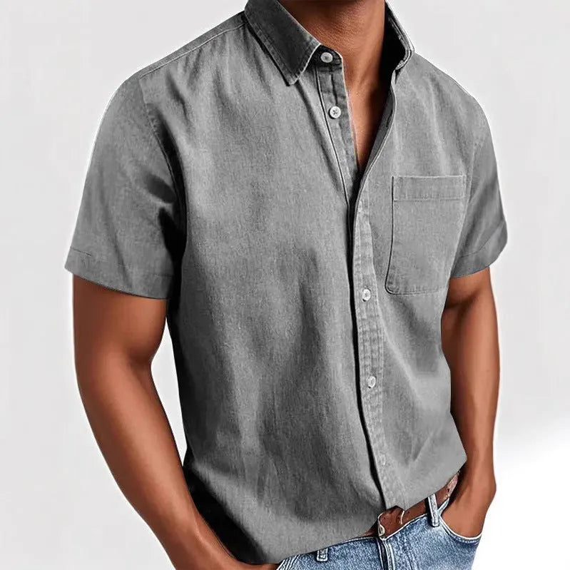 Men's solid colour short-sleeved polo shirt with a classic collar and a single chest pocket.