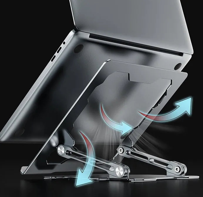 Grey aluminium laptop stand folded flat next to an open laptop, showing its adjustable angle and hollow design.