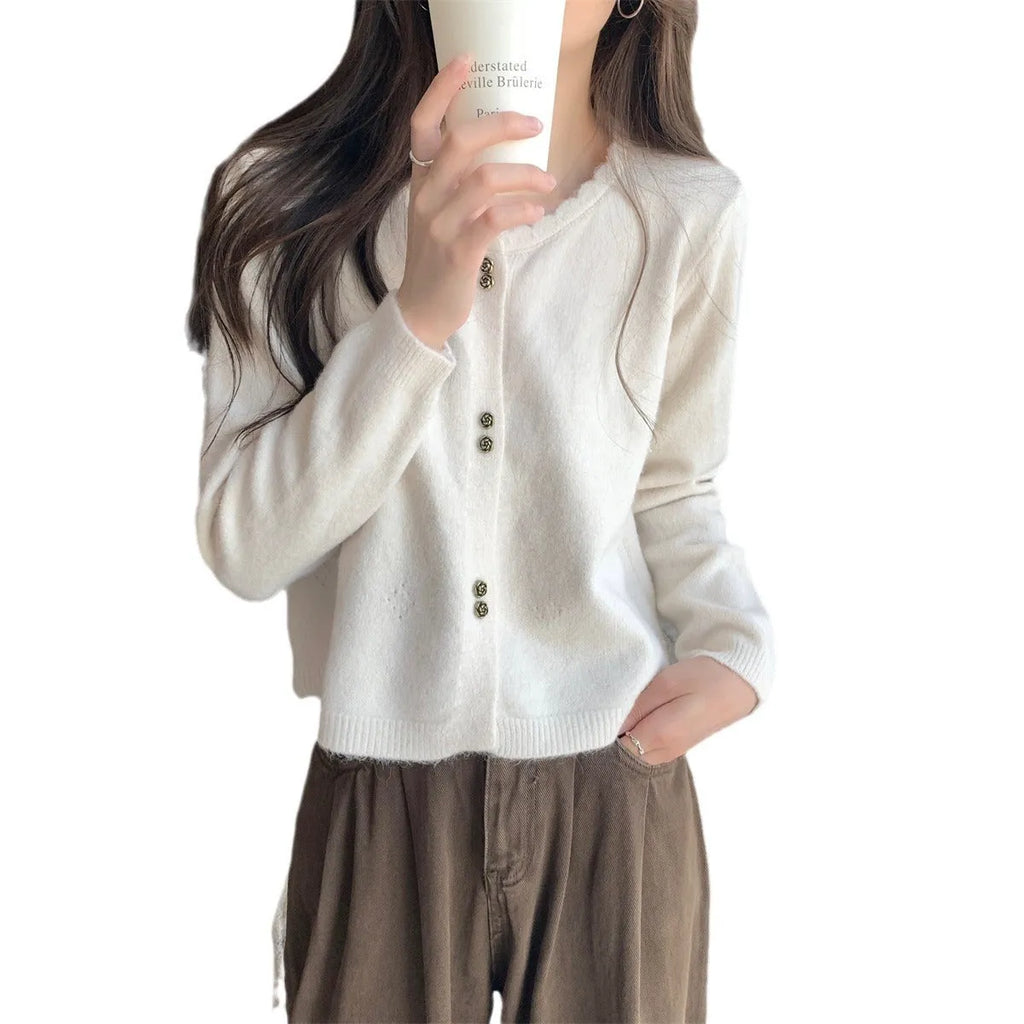 Women's long-sleeved acrylic cardigan coat in multiple colours with regular sleeves.
