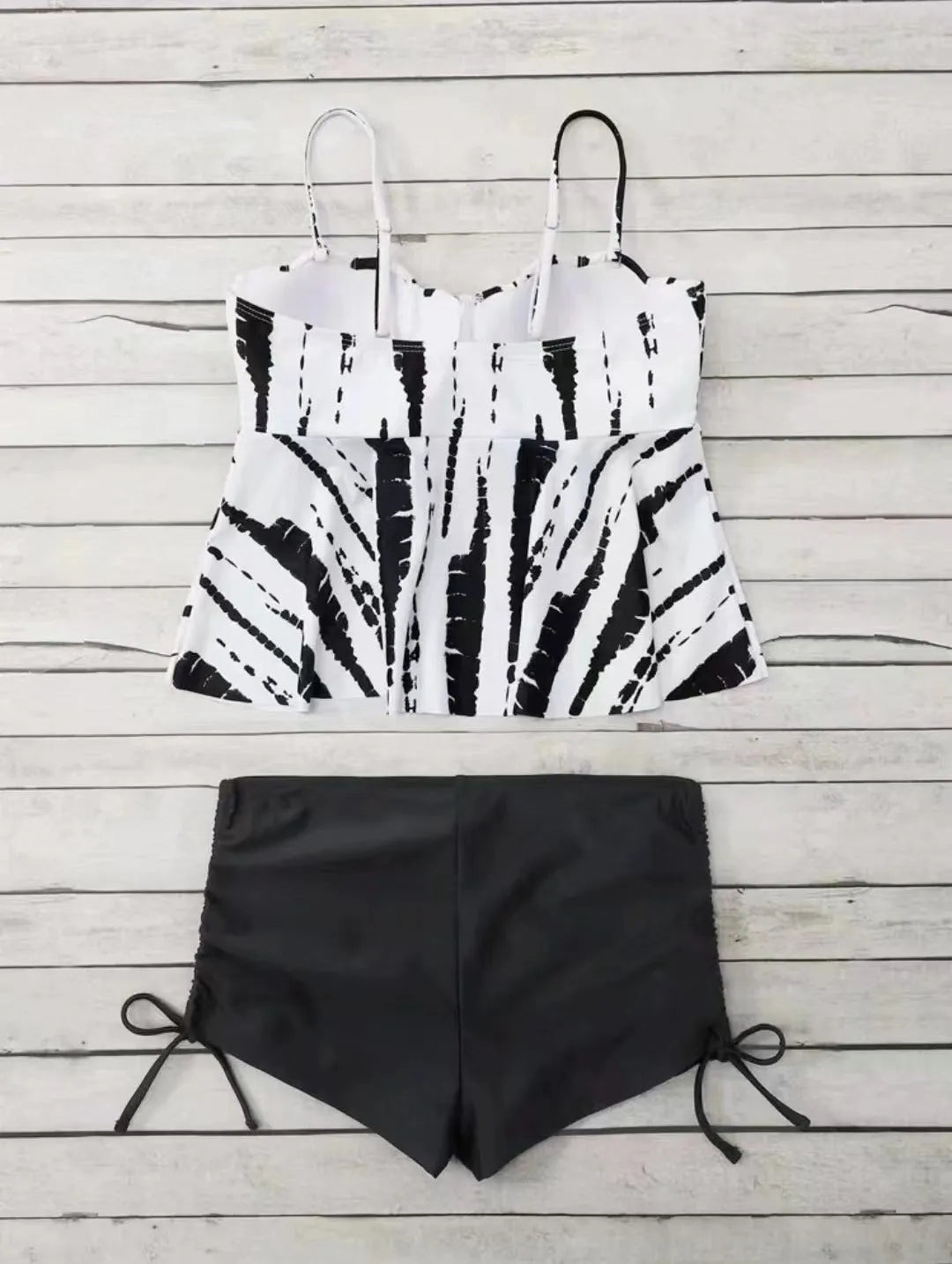 Women's geometric print split bikini swimsuit in blue, shown as a top and shorts set.