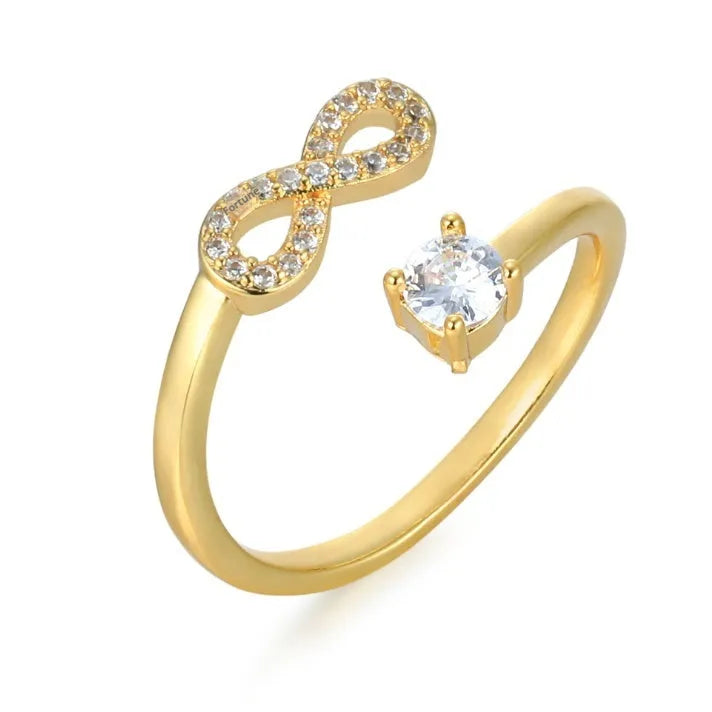 Personalised geometric open ring with inlaid zircon stones, shown on a finger, available in gold, rose gold, and silver.