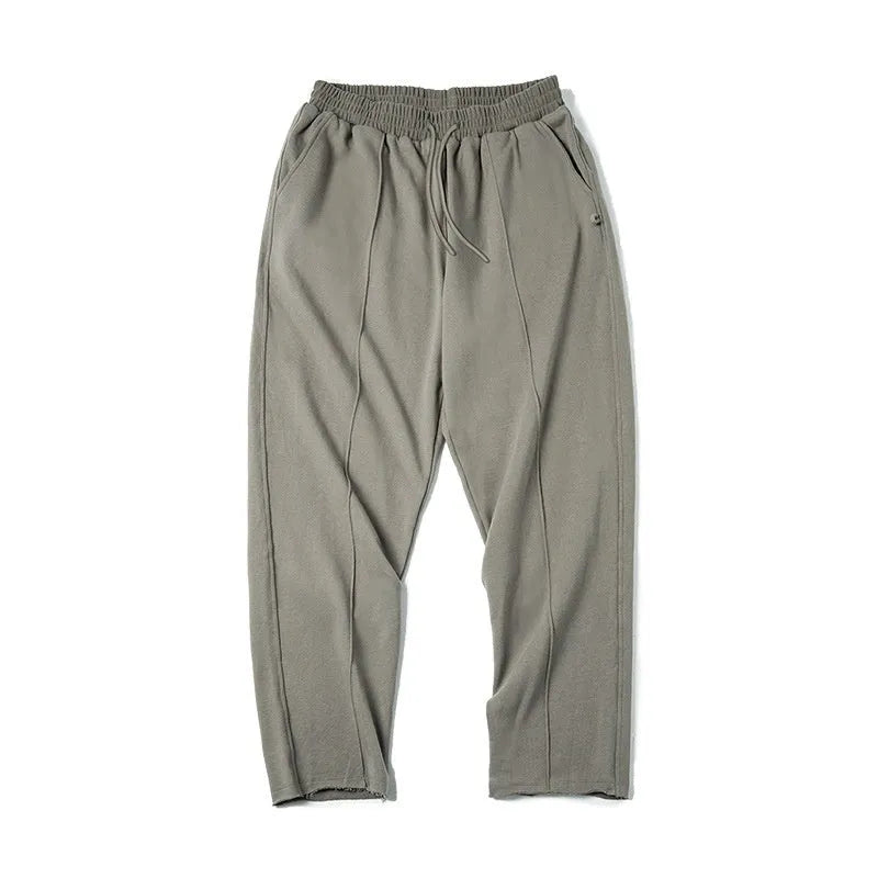 Men's cotton knitted sweatpants in olive green with tapered 3D cut hemming, straight leg retro style