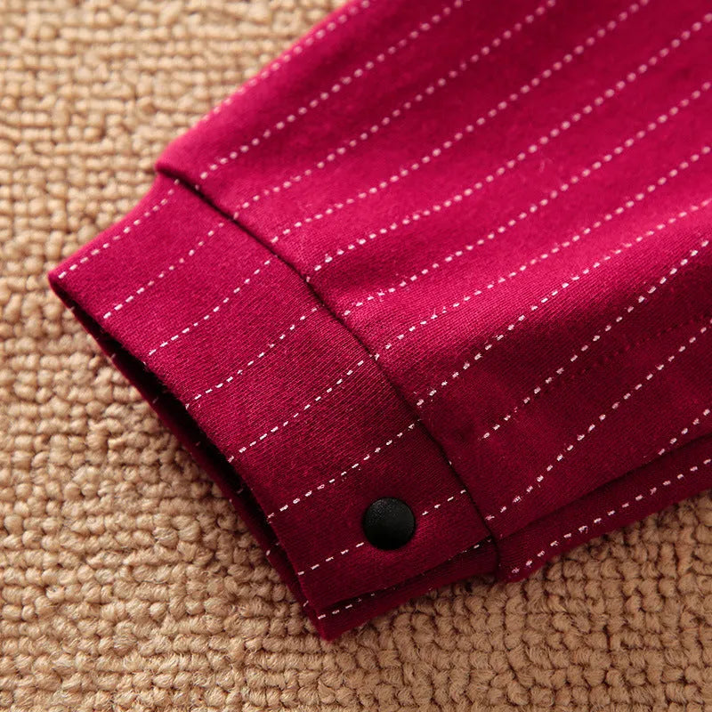 Baby boy in a wine red gentleman-style long-sleeved cotton jumpsuit.
