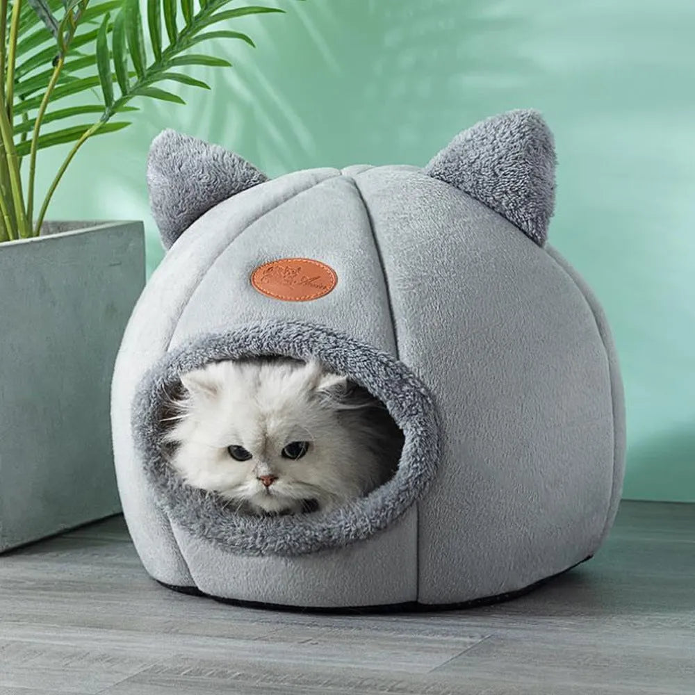 Fully enclosed plush cat winter nest sofa bed with removable cushion, shown in grey