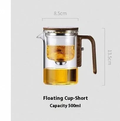 Glass teapot with wooden handle showing magnetic tea separation button and detachable inner infuser.