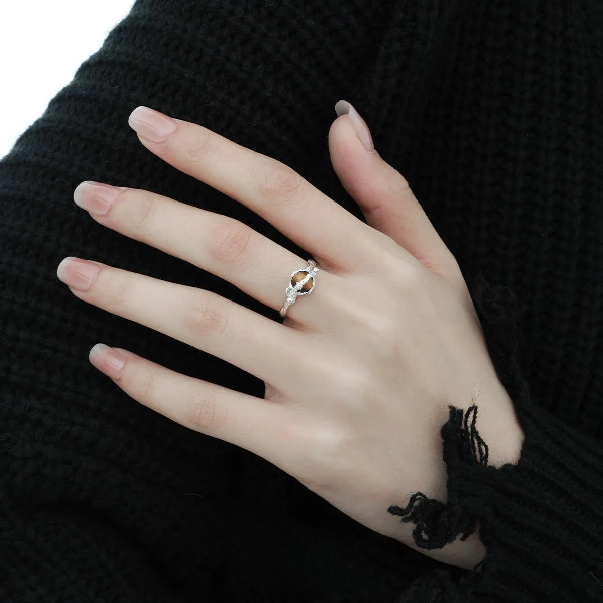 Saturn design adjustable silver ring with white gold electroplated finish and tigereye open pattern
