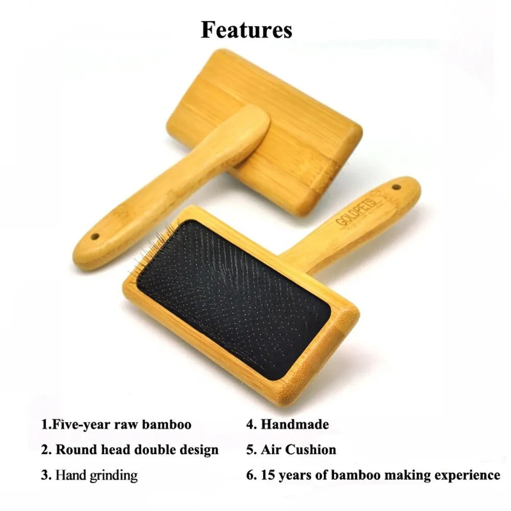 Goldpets bamboo and wood pet slicker brush with stainless steel pins on a wooden table.