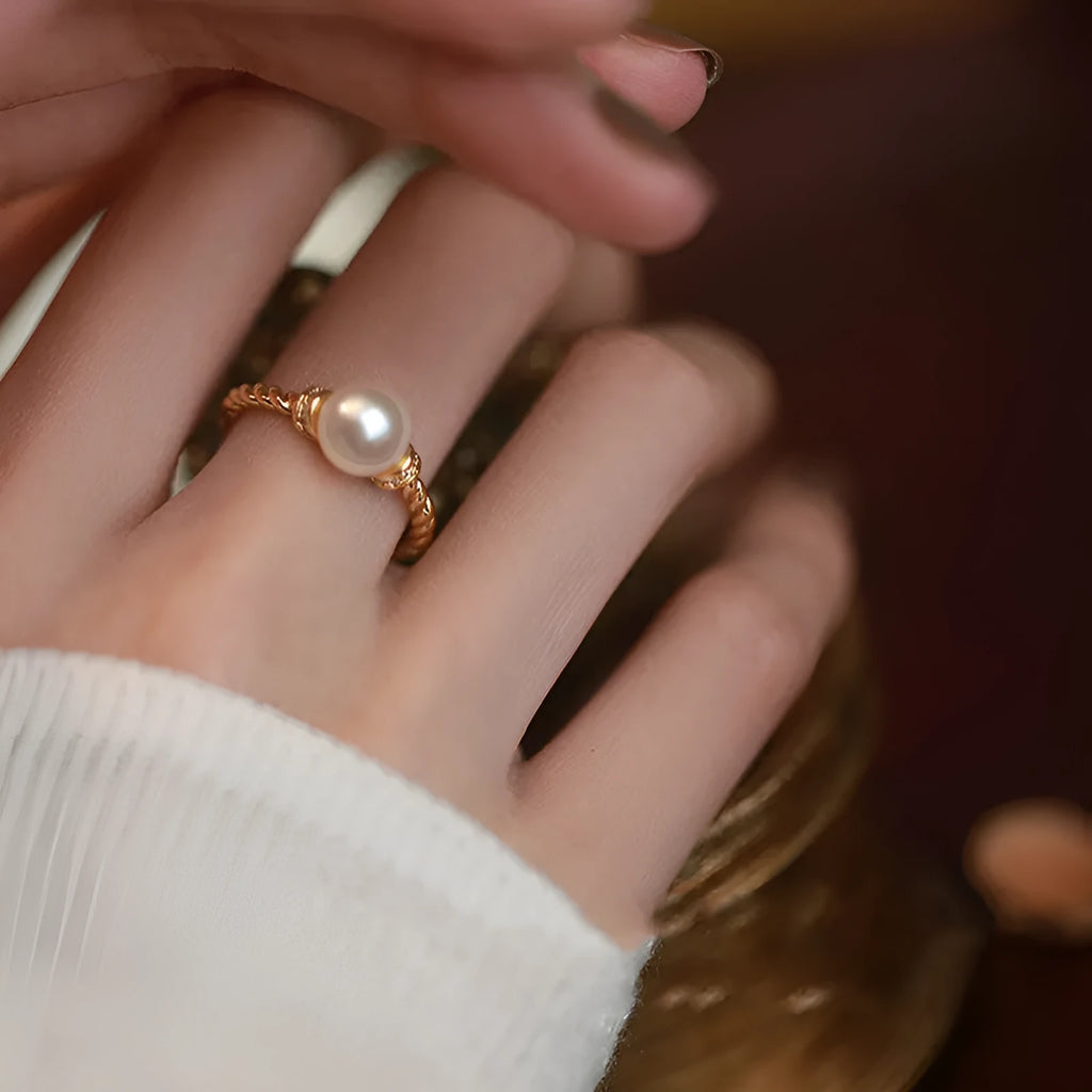 Adjustable antique twist copper ring with geometric pearl inlay in gold and silver colours.