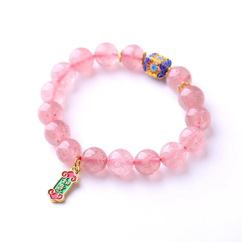 Pink strawberry quartz crystal bracelet with hand-woven construction and traditional Chinese ruyi lucky symbols