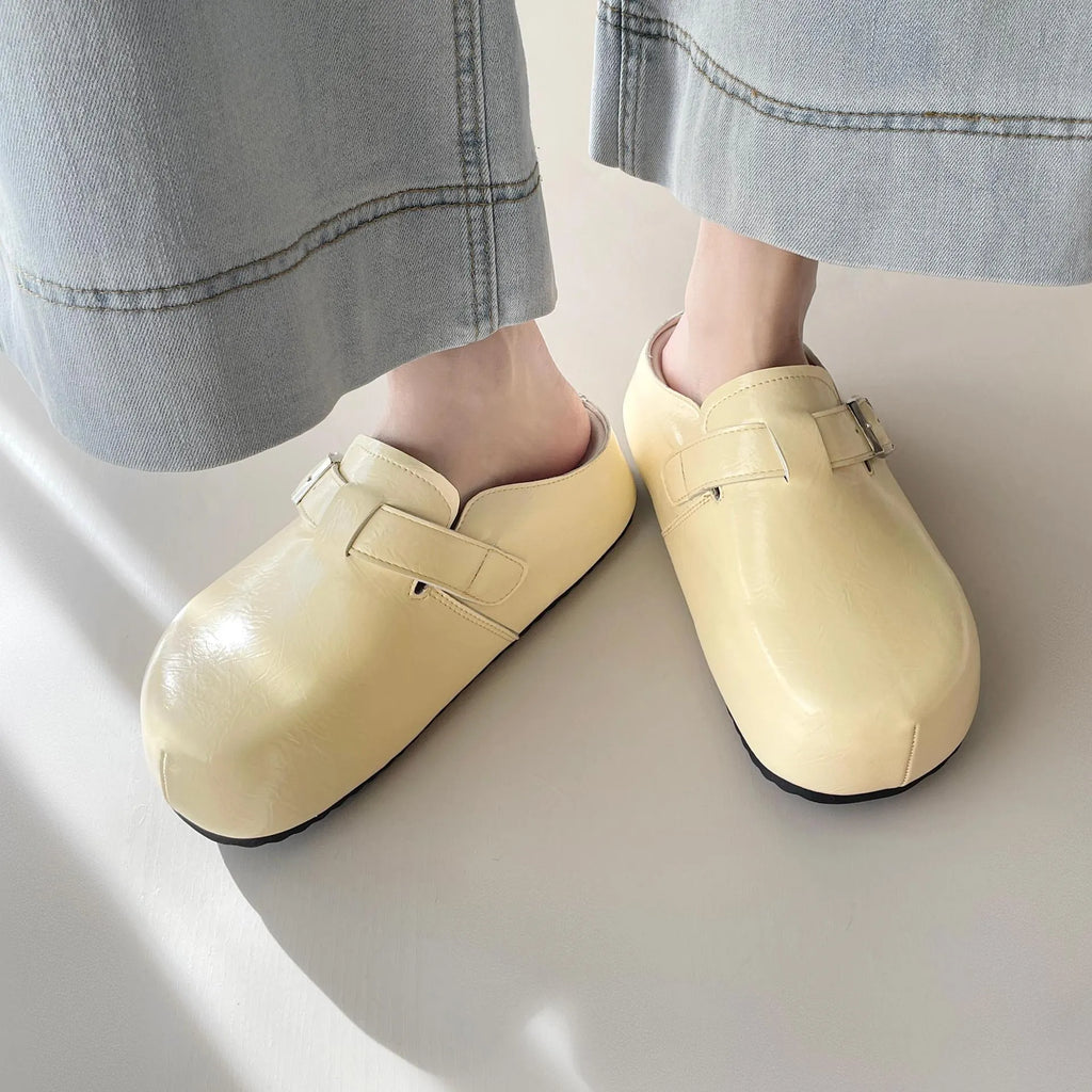 Flat buckle casual sneakers with round toe in yellow, creamy-white, silver, and black colours