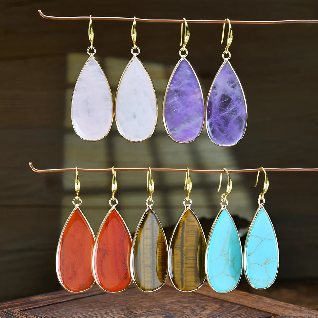 Vintage long water drop earrings in tigereye stone with textured surface and dangle silhouette