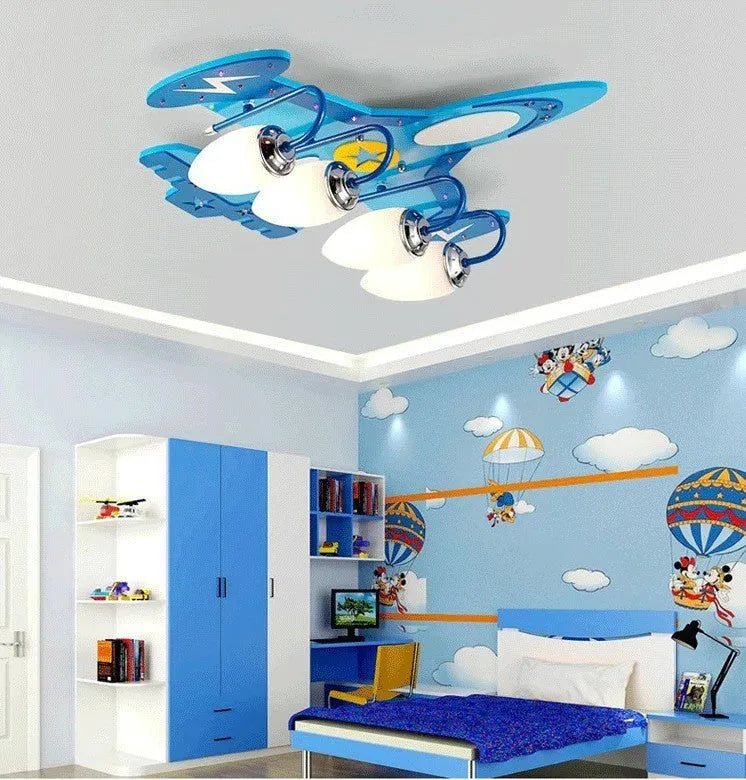 Children's cartoon airplane design LED ceiling light with glass shade and wood fitting.
