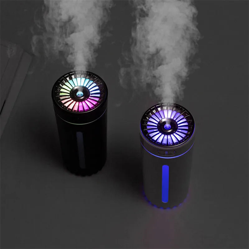 Black portable car humidifier with colourful lights on a car dashboard cup holder