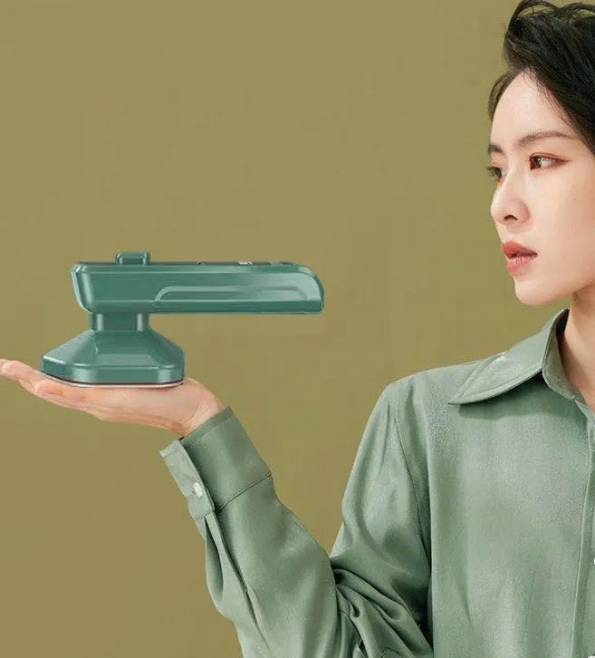 Dark green portable hanging ironing machine with ceramic panel and handheld design.