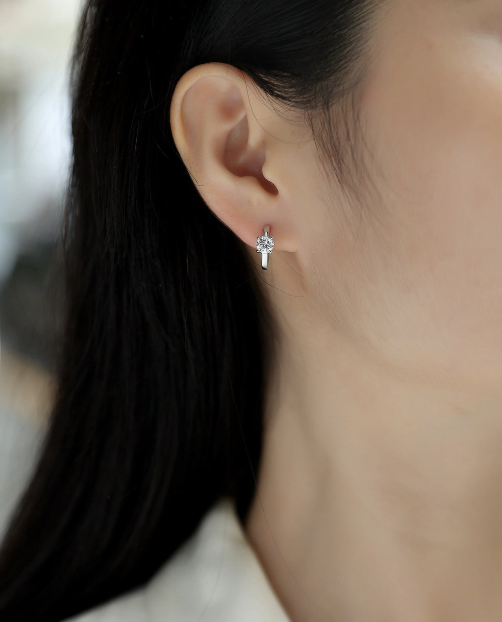 0.5-carat top-quality moissanite stud earrings in S925 silver with platinum plating on white background
