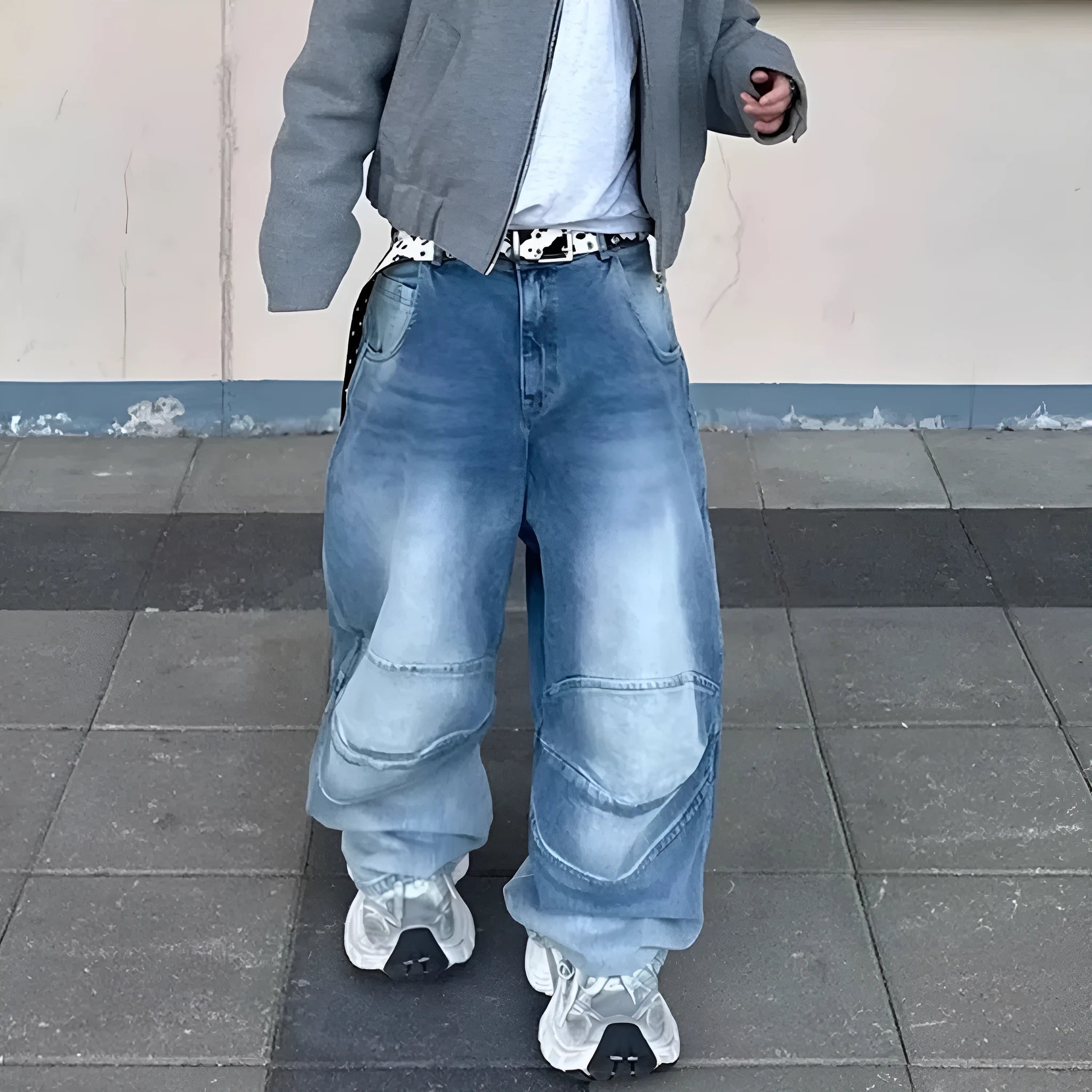 Men's straight leg baggy jeans in a washed blue denim colour with a zip fly.