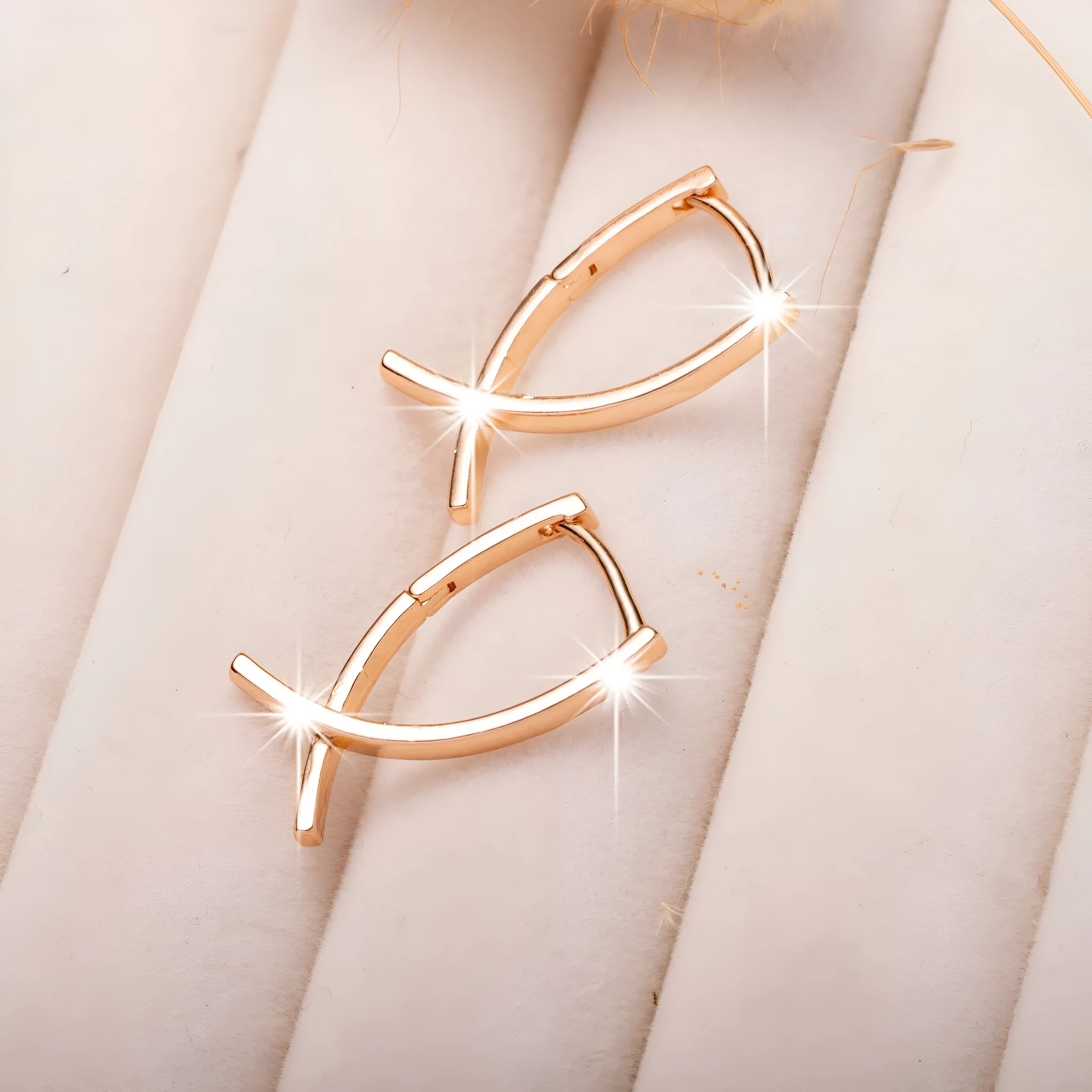 Rose gold cross shaped earrings on a copper base, light luxury style
