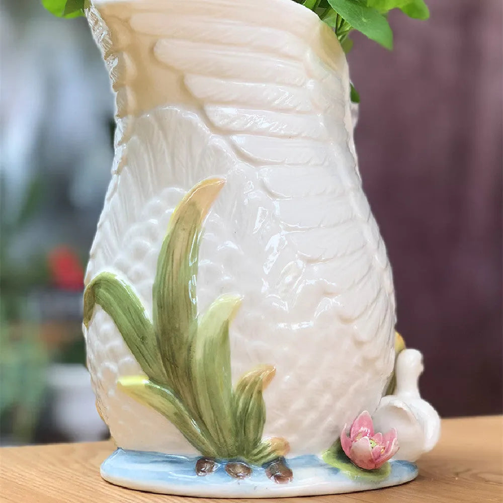 Ceramic vase with embossed swan pattern, pastoral style, 24.1cm length, picture colour, on a shelf