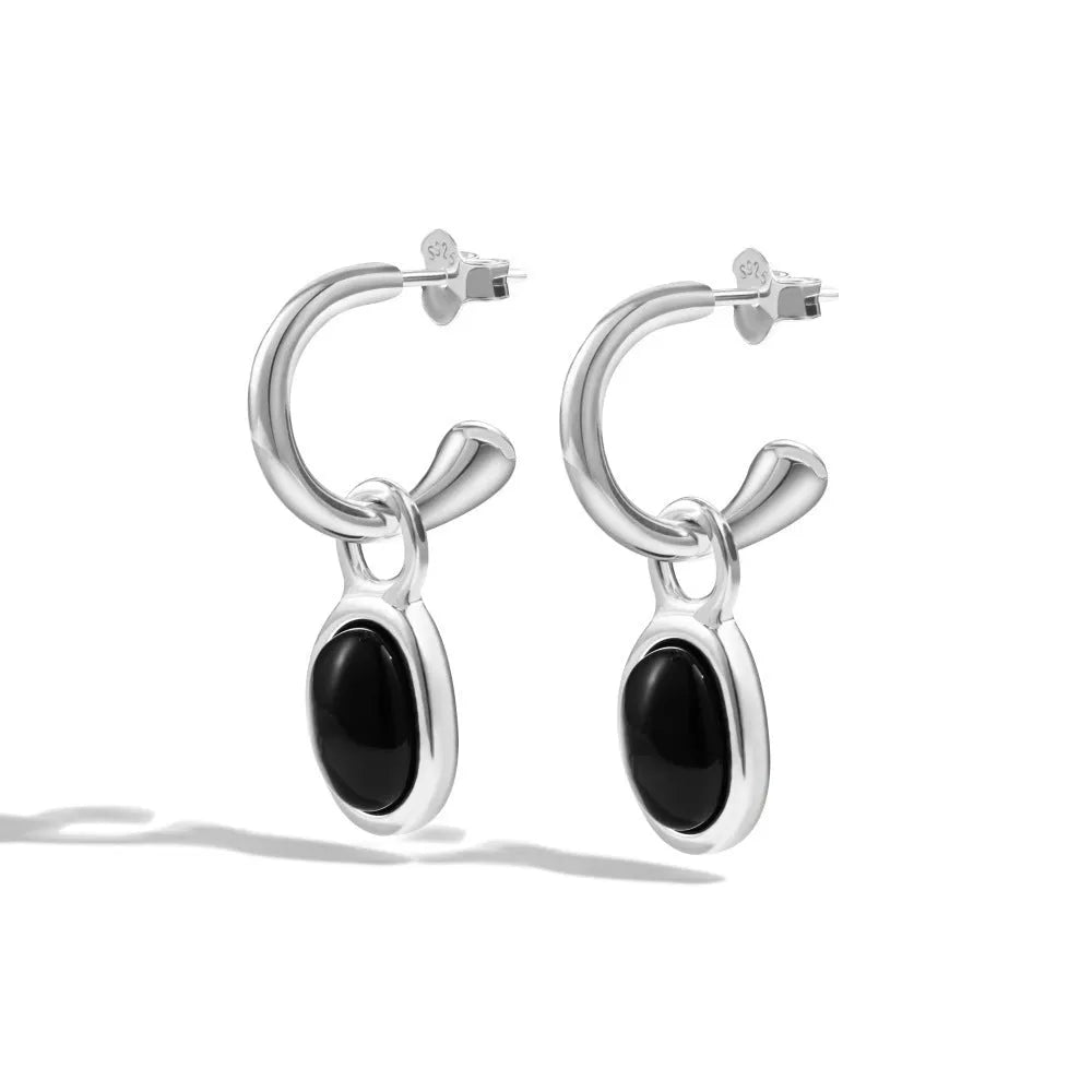 S925 sterling silver stud earrings for women with black agate and a geometric ellipse shape in silver