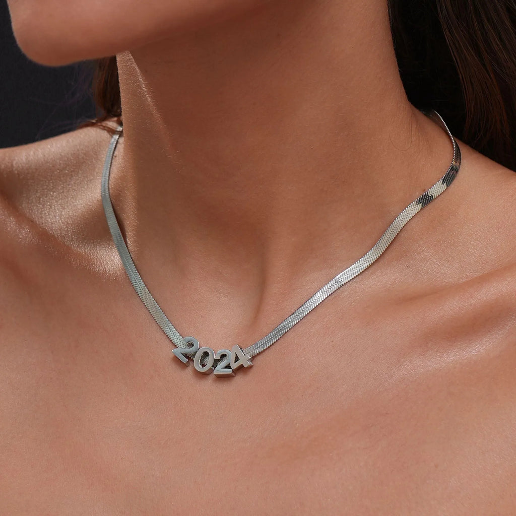 Gold electroplated titanium steel necklace showing letter A pendant on a 40.5cm blade chain