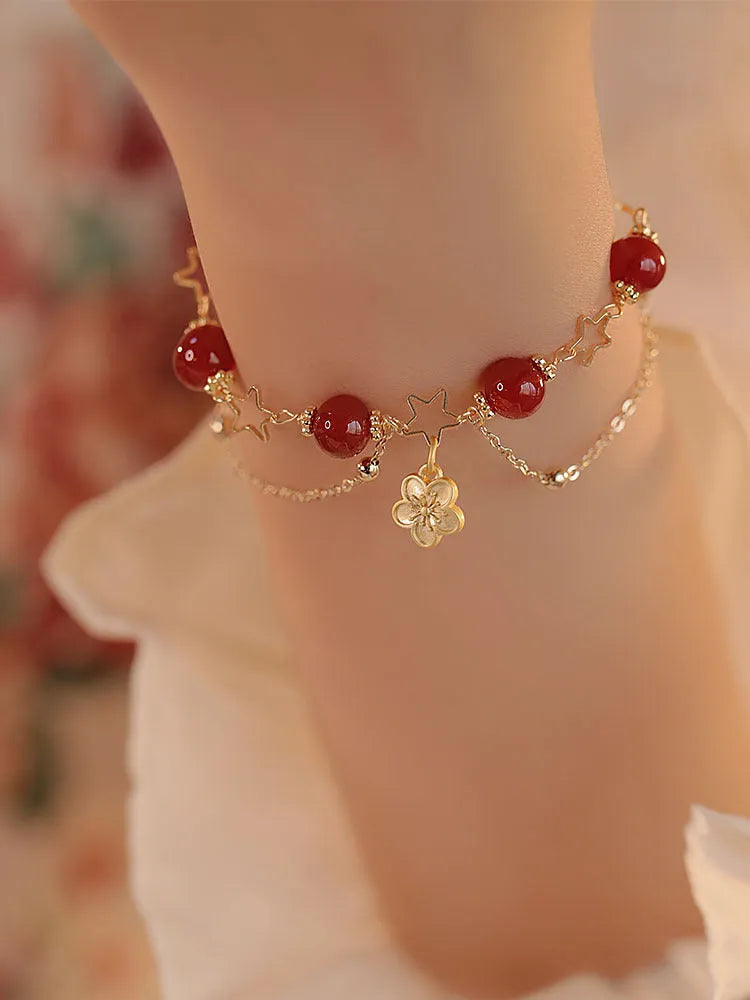 Women's red agate bracelet with double layer design and peach blossom floral elements