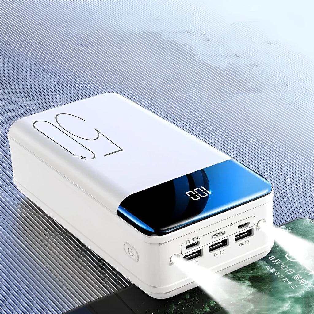 Black and white 50000mAh power bank showing three USB output ports and compact design