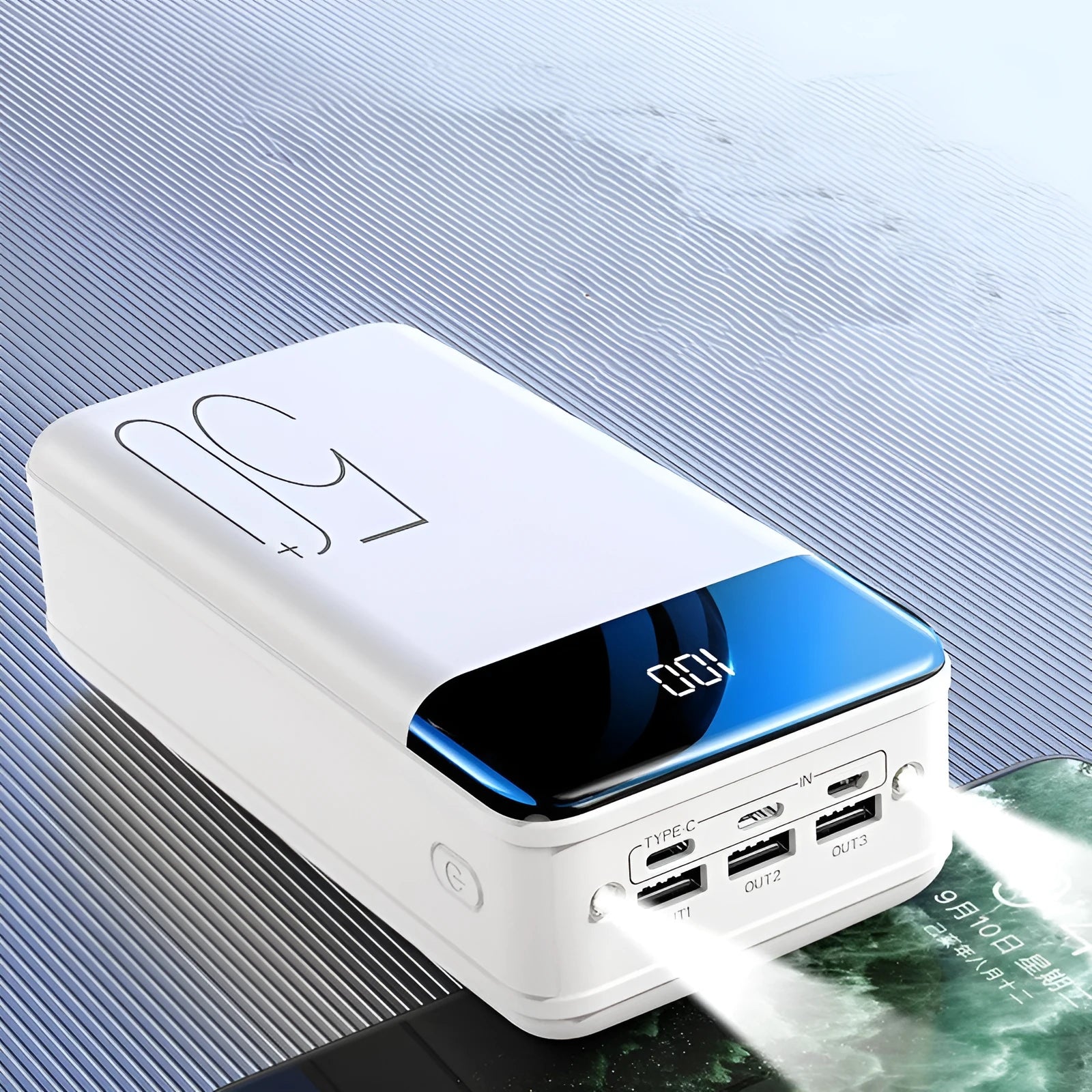 Black and white 50000mAh power bank showing three USB output ports and compact design