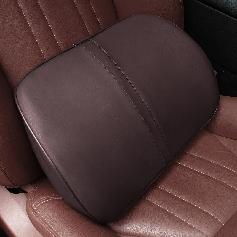 Car seat cushion headrest with memory foam interior and leather exterior in solid colour