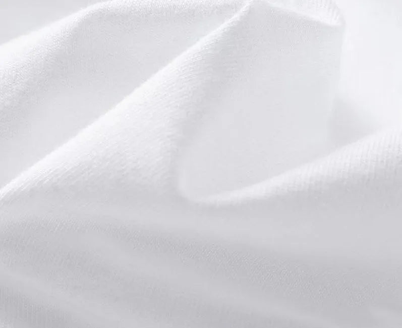 A man wearing a loose-fit black pure cotton short sleeve t-shirt, suitable for business casual settings.