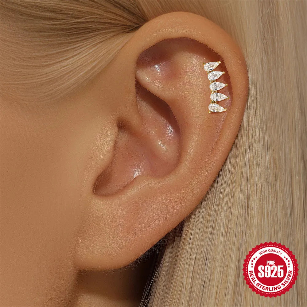 S925 sterling silver moon earring with a small diamond set in a star design on a gold-toned background.