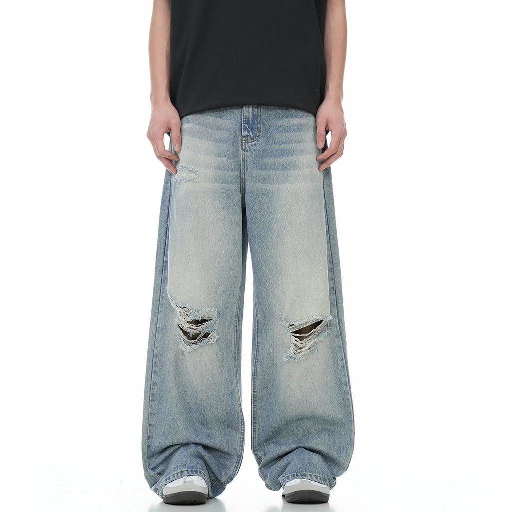 Blue straight-leg men's jeans with retro ripped detailing and zipper fly