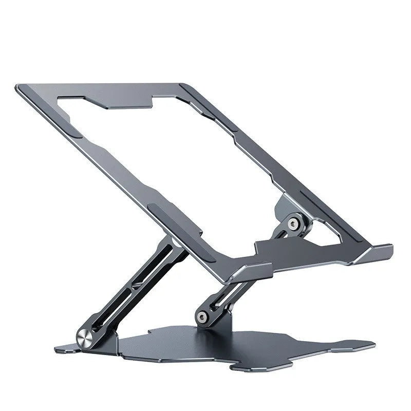 Grey aluminium laptop stand folded flat next to an open laptop, showing its adjustable angle and hollow design.