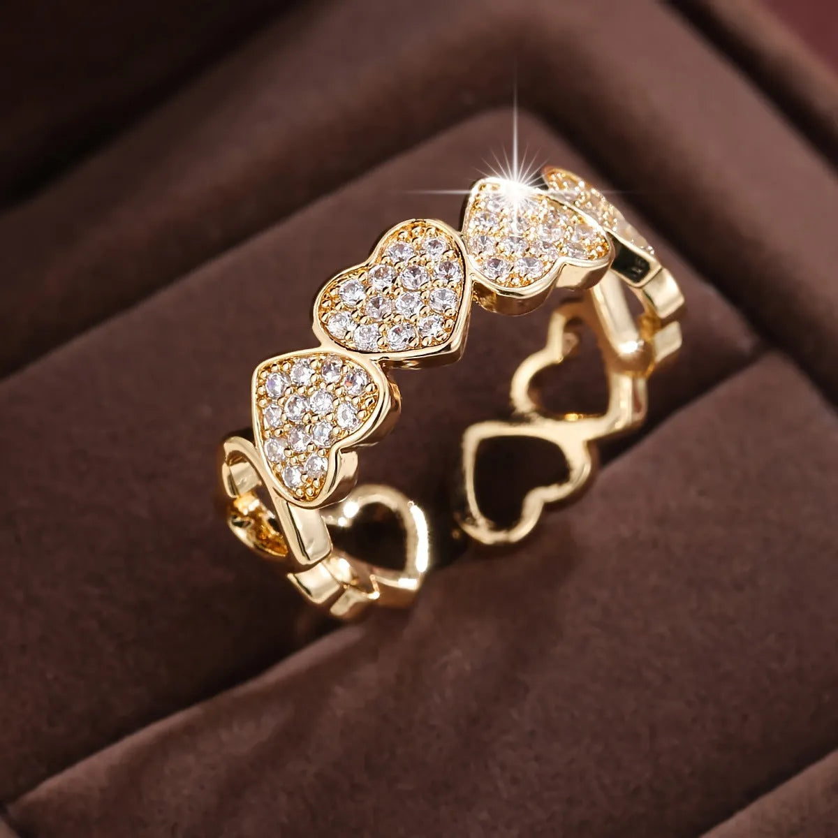 Adjustable copper fashion ring with a heart design, shown in gold and silver colour options.