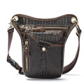 Men's brown Crazy Horse leather retro satchel bag with flap closure on a table.
