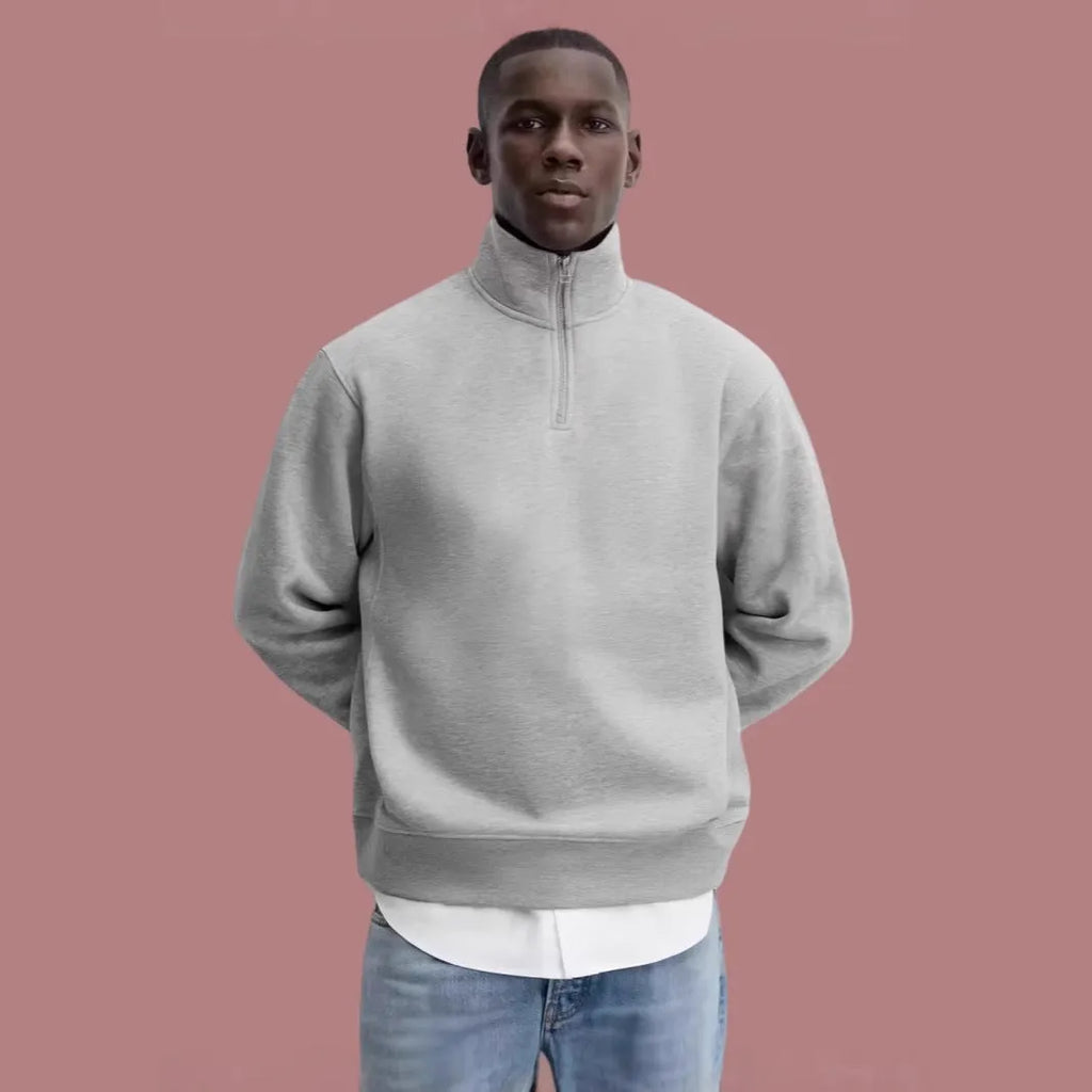 Grey half-zip stand collar cotton sweater with long sleeves on a hanger
