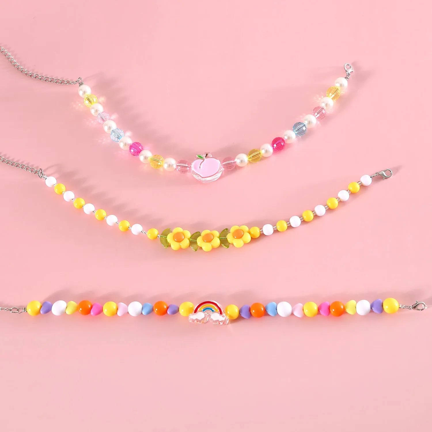 Colourful plastic pearl bead cat collar necklace showing rainbow, peach and small flower design options