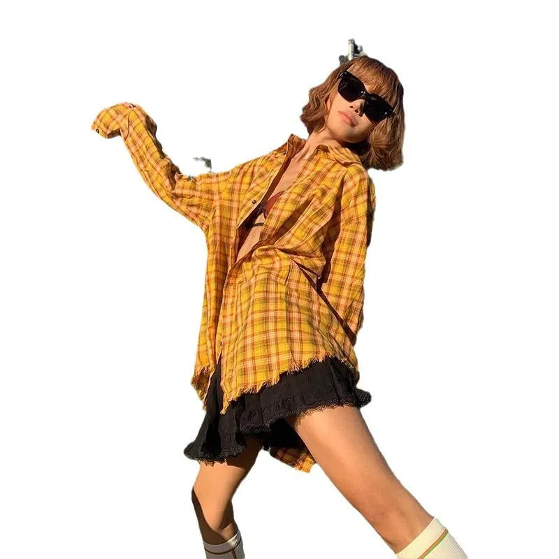 A man and woman modelling a loose-fit yellow plaid cardigan-style shirt.