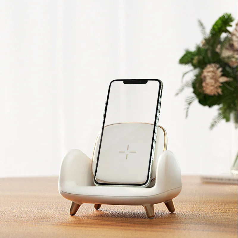 White wireless fast charger pad with USB interface on a desk