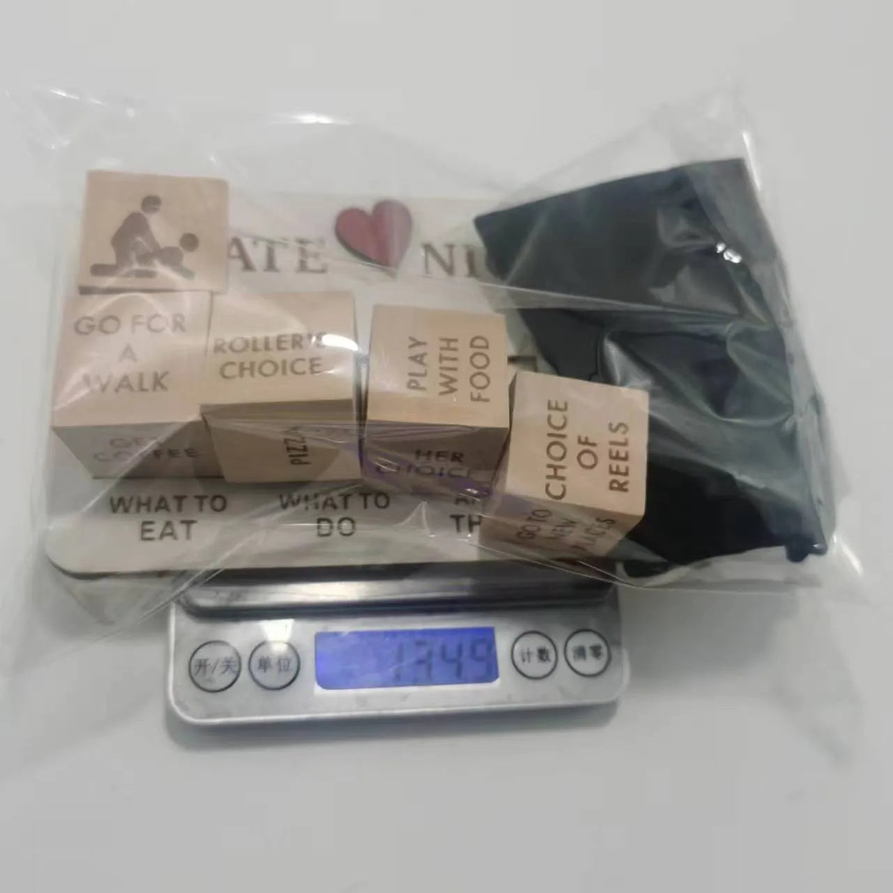Wooden date night dice set with five natural wood dice, date planner board, and black storage bag for couple games