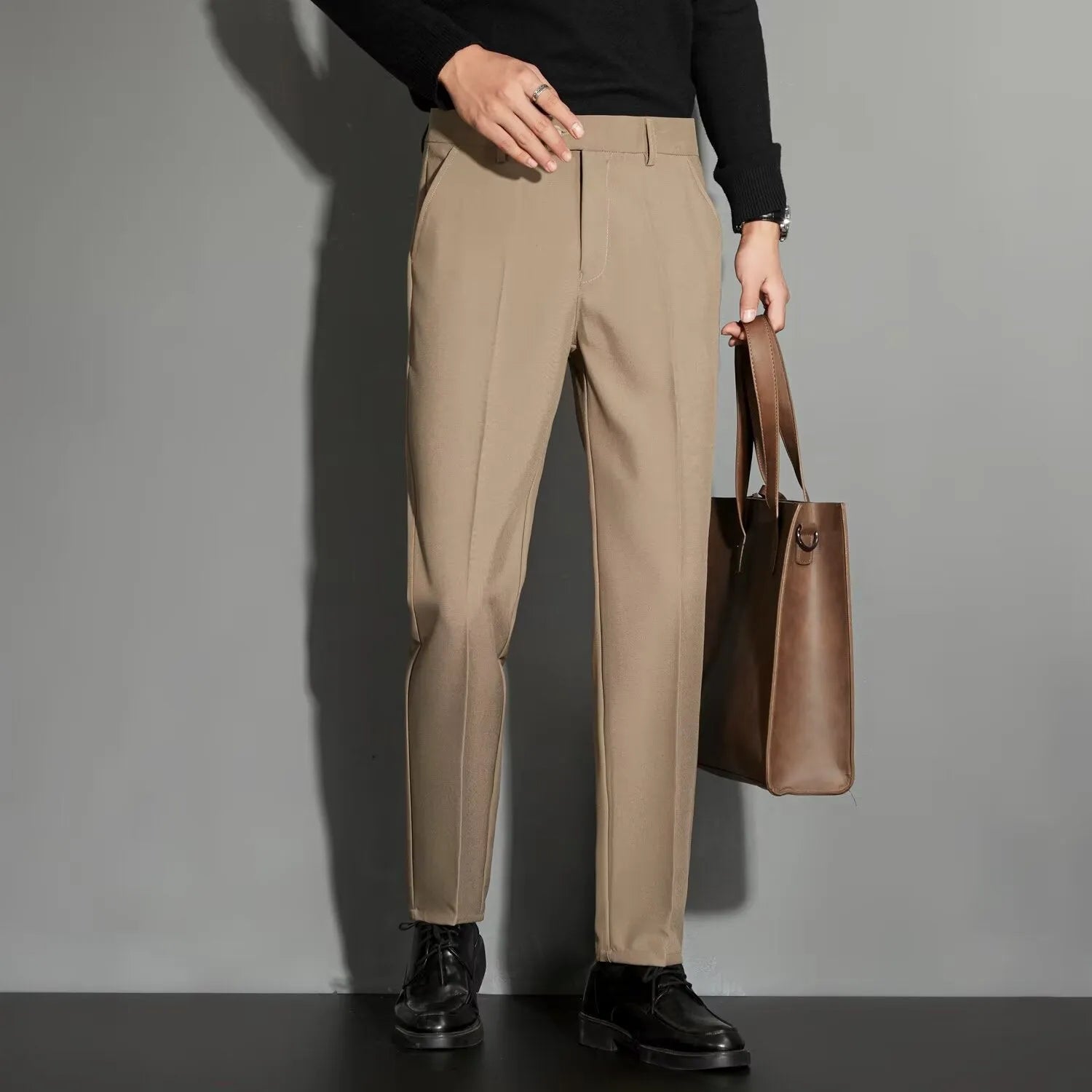 Men's straight-leg ankle-length suit trousers in apricot colour showing business gentleman styling with lightweight draping effect