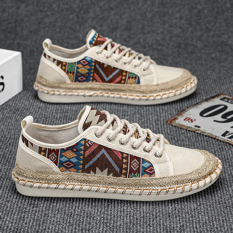 Men's beige and black cloth casual shoes with round toe, shown from the side.