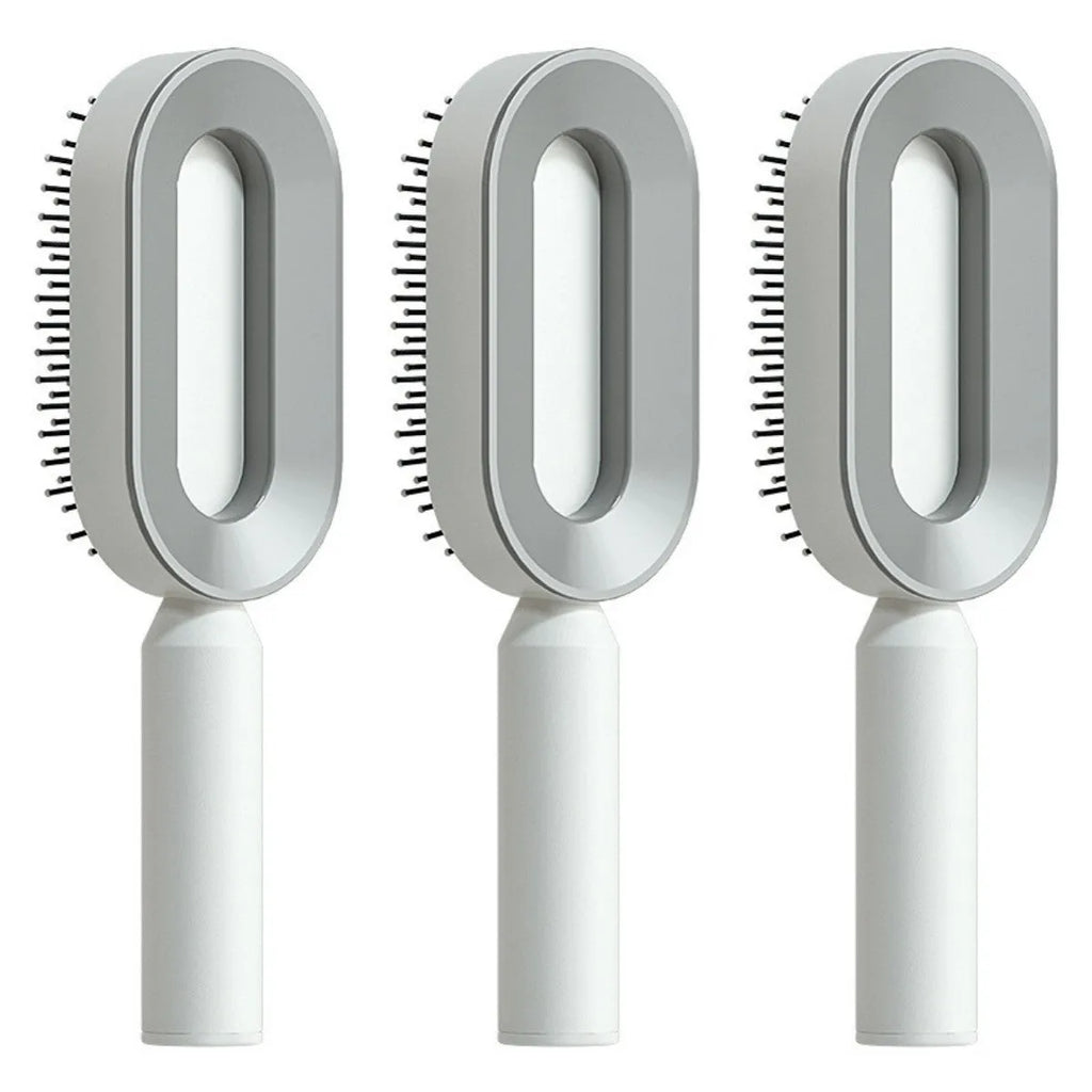 Self-cleaning air cushion hair brush in white, black gold, or black purple with ergonomic handle